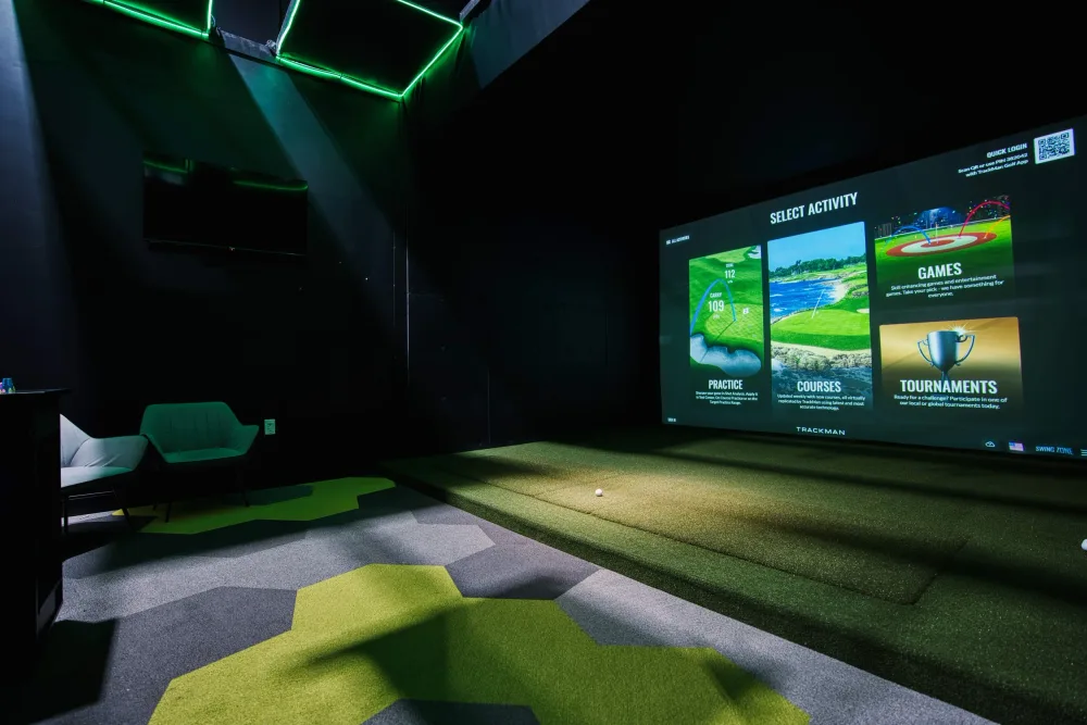 A comfortable private Swing Zone golf simulator room